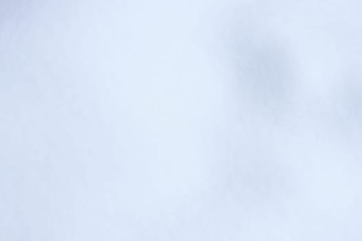 Soft snow hills surface. Snowy mound texture. Winter snowdrift landscape background.