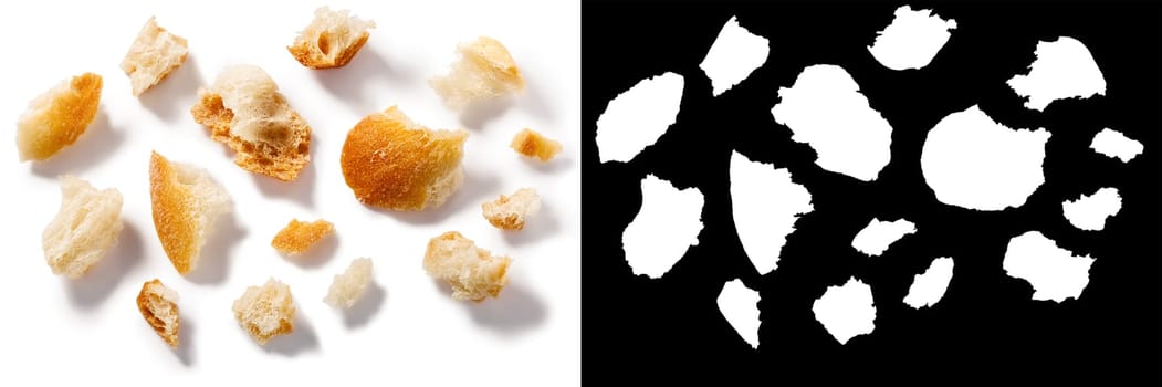 Bread or baguette crumbs, roughly cut or broken pieces isolated, top view