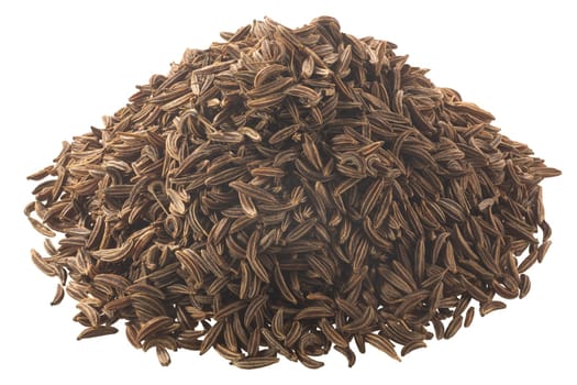 Pile of dried caraway seeds (Carum carvi fruits), isolated