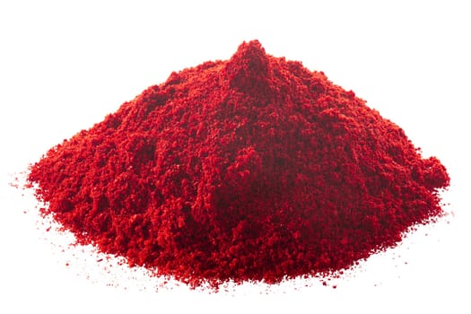 Pile of ground red chile pepper or paprika, isolated