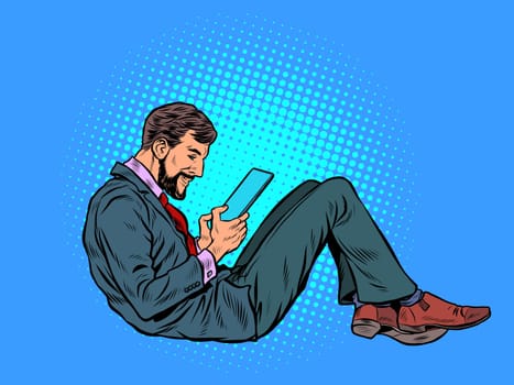 A man reads an electronic tablet. Pop art retro vector illustration kitsch vintage 50s 60s style