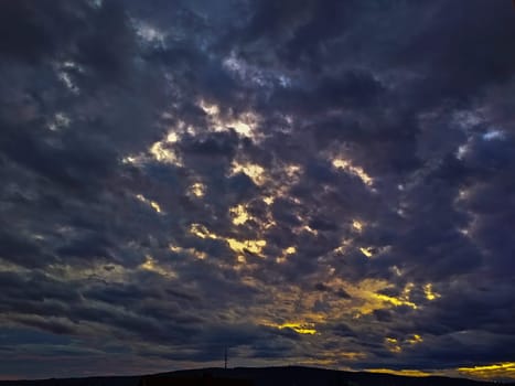 Stormy clouds passing over the hill