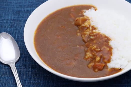 Close up of Japanese curry rice with spoon on table