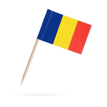 Miniature paper flag Romania. Isolated Romanian toothpick flag pointer on white background. With shadow below