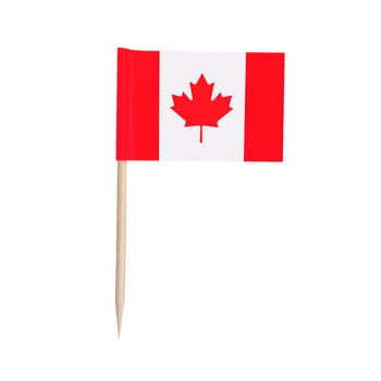 Miniature paper flag Canada. Isolated Canadian toothpick flag pointer on white background.