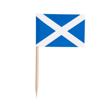 Miniature paper flag Scotland. Isolated Scottish toothpick flag pointer on white background.