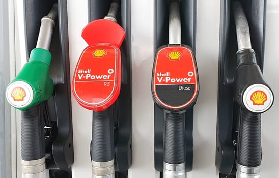 PRAGUE, CZECH REPUBLIC - MAY 14, 2020: Closeup of refueling guns at Shell gas station. Shell is the largest private oil and gas company in Europe and the second largest in the world on May 14, 2020 in Prague.