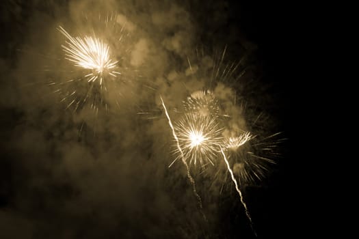 Premium entertainment magic star firework at e.g. New Years Eve or Independence Day party celebration. Black dark night background.