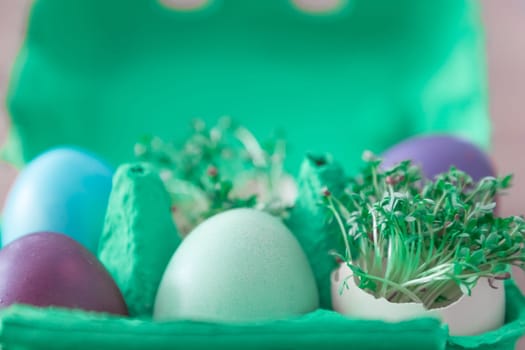 Beautiful decoration easternest basket with painted eggshells for celebration. Lovely traditional gift design on wooden background.