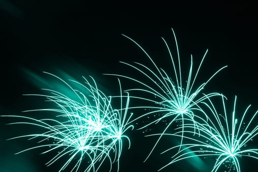Premium entertainment magic star firework at e.g. New Years Eve or Independence Day party celebration. Black dark night background.