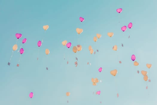 Romantic symbol of future partnership. Group of beautiful heart ballons with congratulations cards at wedding party or valentines day.