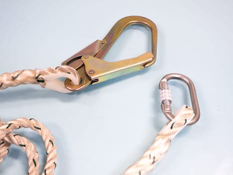Figure eight knot with carabiner. Silver carabiner with lock andrope isolated on white background.