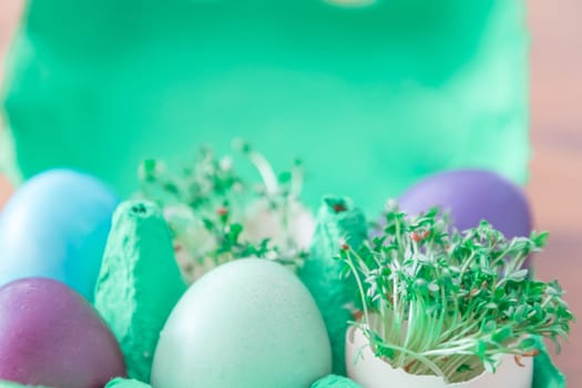 Beautiful decoration easternest basket with painted eggshells for celebration. Lovely traditional gift design on wooden background.