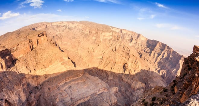 Wide angle view of Wadi Ghul aka Grand Canyon of Arabia in Jebel Shams, Oman