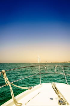 View of Dubai coast from the bow of a yacht