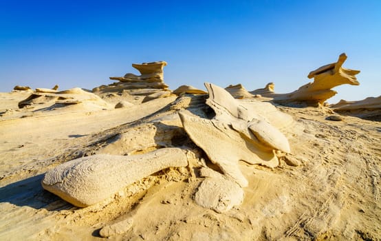 Sandstone formations in Abu Dhabi desert in United Arab Emirates