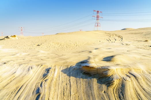 High voltage overhead transmission lines in Abu Dhabi desert