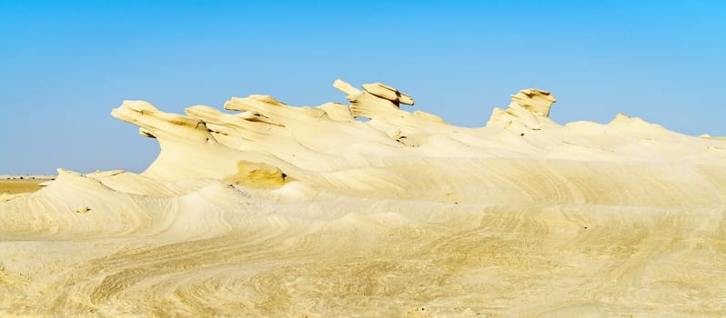 Sandstone formations in Abu Dhabi desert in United Arab Emirates