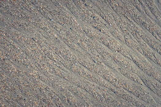 Wet sand water stock texture. Summer beach background.