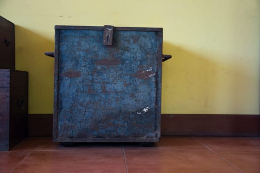 chest on an antique yellow wall  backgrounds
