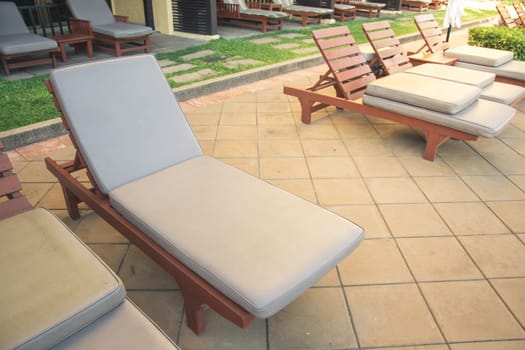 Chairs on a pool deck in hotel