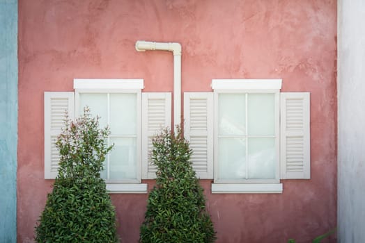light on Vintage window on nice color cement wall can be used for background