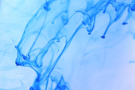 Ambient Ink Drips Dynamic in Water. Abstract Background.