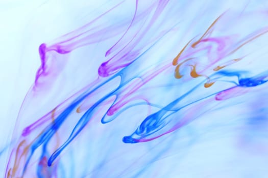 Colored Falling Ink Drops in Water. Abstract Fantasy Background.