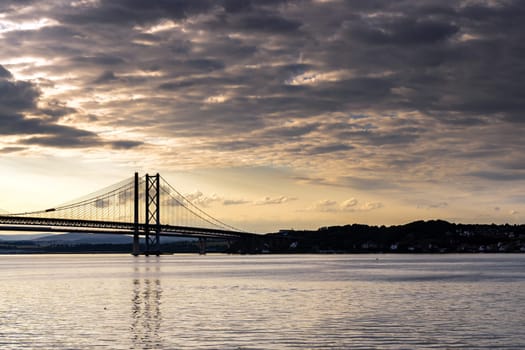Beautiful sunset at The Forth road bridge and Queensferry crossing bridge in Edinburgh Scotland UK.