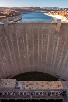 Glen Canyon Dam with Lake Powell in the Desert rural area of Page city Arizona, United States. USA Landmark environmental water resources reservoir and electricity concept.