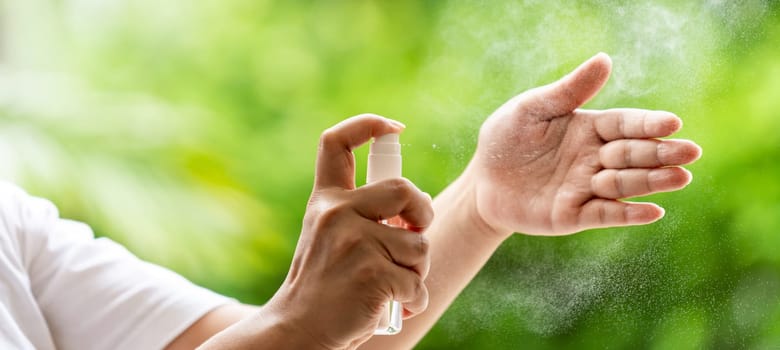 Panoramic web banner cleaning hand by alocohol spray Hand sanitazer from bottle spraying, disinfection safety prevent and protect from infection of virus and germ Covid-19 coronavirus world pandemic.