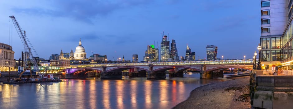 Panoramic of St paul cathedral with river thames sunset twilight in London UK.
