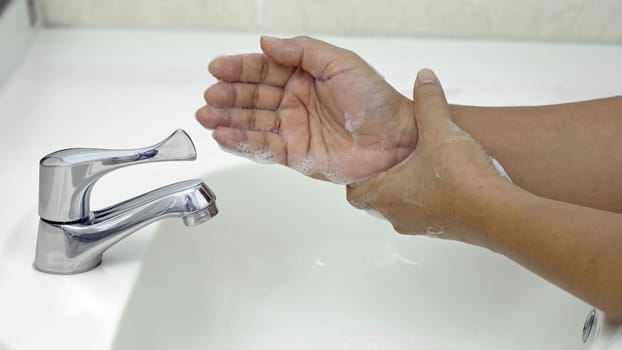 7 steps hand washing - Step 7/7 Rub both weists rotating manner, protection from coronavirus COVID-19 infection