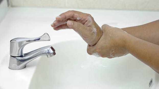 7 steps hand washing - Step 7/7 Rub both weists rotating manner, protection from coronavirus COVID-19 infection