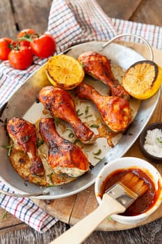 Marinated chicken drumsticks with herbs and lemon