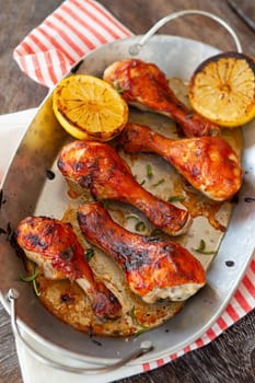 Marinated chicken drumsticks with herbs and lemon