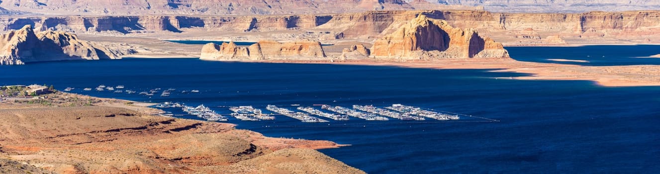Panorama of Lake Powell in desert Landscape and yacht Marinas recreation center at Page city Arizona, United States. USA Landmark environmental water resources reservoir sport and recreation concept.