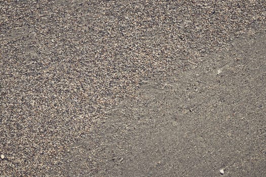 Sand texture with large and small grains transition. Summer beach background.