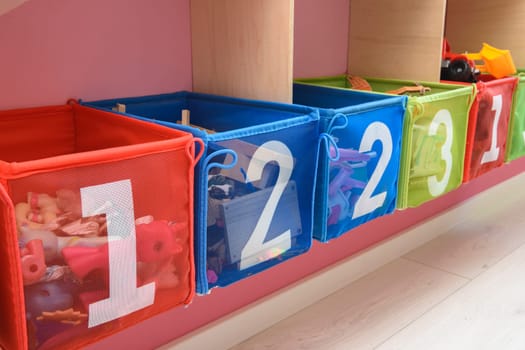 multi-colored boxes with numbers filled with little things