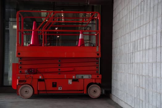 distribution warehouse hall with hydraulic scissors lift platform