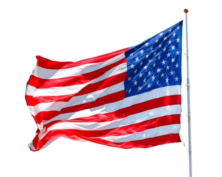 American flag waving in the wind isolated on white background, US flag motion close-up, red white blue flag outdoors in sunlight. United States of America national flag. USA stars and stripes