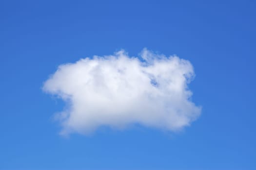 Single white cloud on a blue sky background.