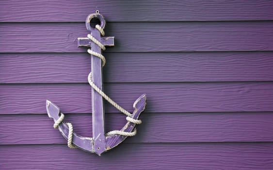 wooden anchor on wall vintage background