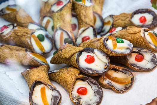 Sicilian Cannoli - traditional italian dessert with ricotta cheese and pistachios. Sicily, Italy.