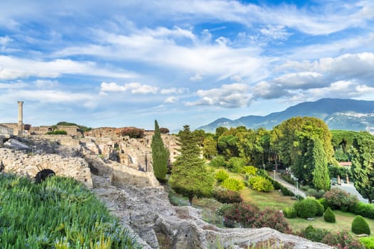 Pompeii in Italy, ruins of the antique Temple of Apollo with bronze Apollo statue, Naples.