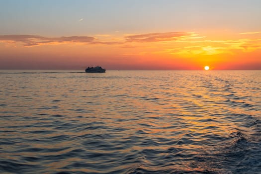 Orange sunset in sea from the coast of Sicily.