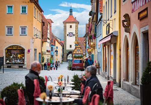 Rothenburg Ob Der Tauber, Germany - SEPTEMBER 24, 2014: View on old city street with traditional architecture of Rothenburg Ob Der Tauber, Bavaria, Germany, Europe