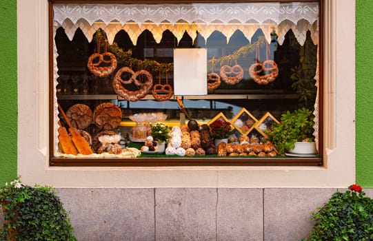 Shop window with traditional bakery in old city street with traditional architecture of Rothenburg Ob Der Tauber, Bavaria, Germany, Europe