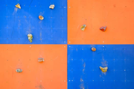 A wall to train climbers. Artificial stones are ledges on the wall.
