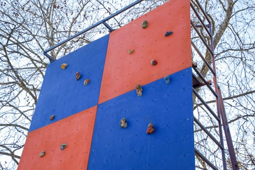 A wall to train climbers. Artificial stones are ledges on the wall.